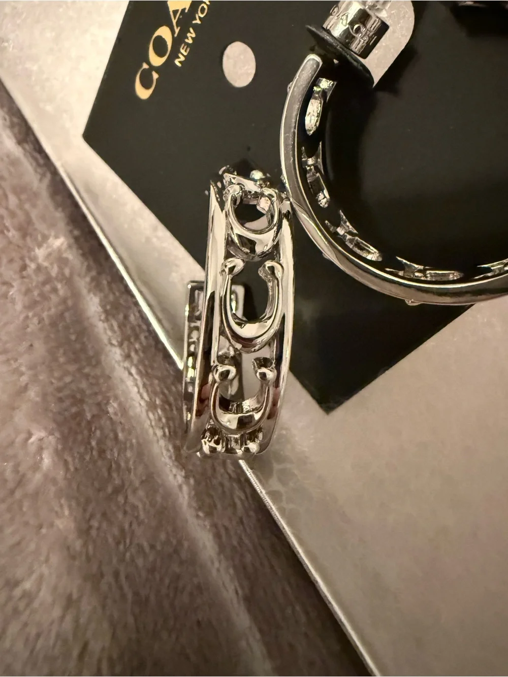 Coach Silver-Tone Decorative Hoop Earrings - Picture 2 of 3